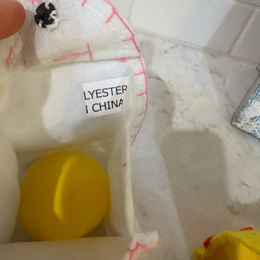 Kids Yellow Bunny Sunglasses and 2 felt bags each with a plastic egg